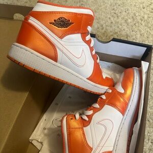 Electric orange and white Jordans
